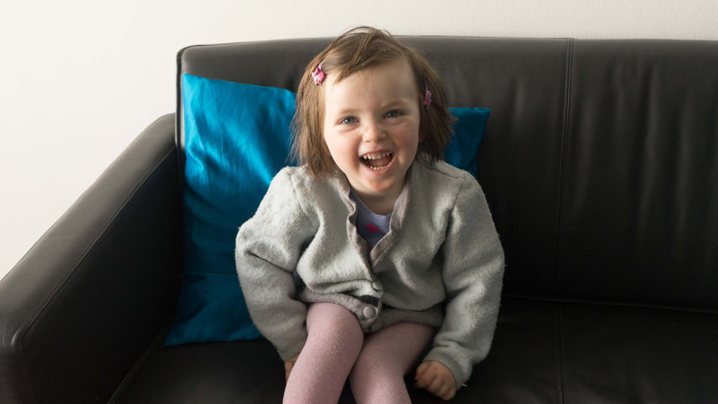 2-year-old girl in a shrunken wool sweater