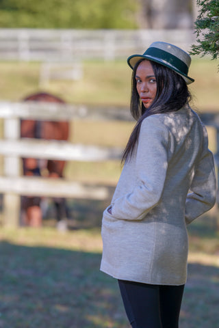 young woman wearing tan boiled wool jacket from Robert W. Stolz collection