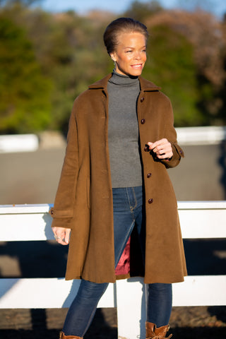model wearing smooth brown cashmere Robert W. Stolz loden coat in Potomac Maryland