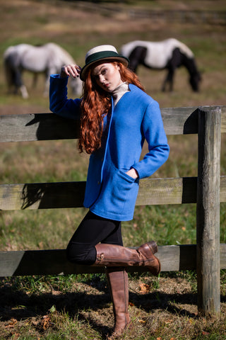 young model wearing light blue austrian boiled wool jacket in morning light