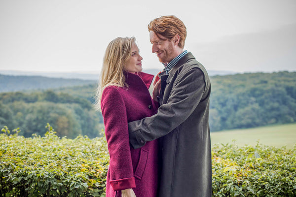 young couple wearing wool coats in Austria