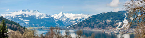 snow capped mountains with fall colors and lake