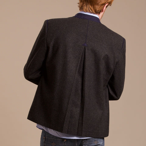 the backside of a Robert W. Stolz austrian loden jacket with traditional arrow pleat