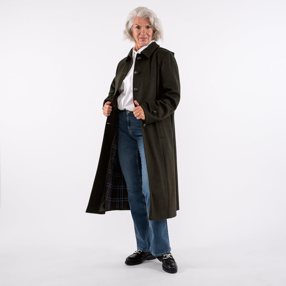 gray haired women wearing german style loden coat