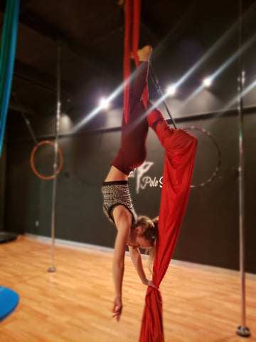 Girl doing a MaidenHead in our Red Aerial Silks