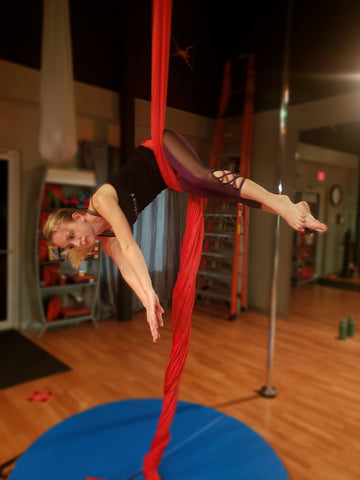 Girl doing a Hip Key Pose in our Red Aerial Silks