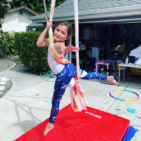 Little Girl on Rainbow Aerial Silks Set by Uplift Active