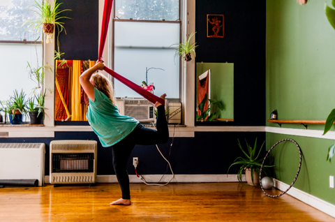 Girl doing an Aerial Yoga Pose in our Aerial Hammock