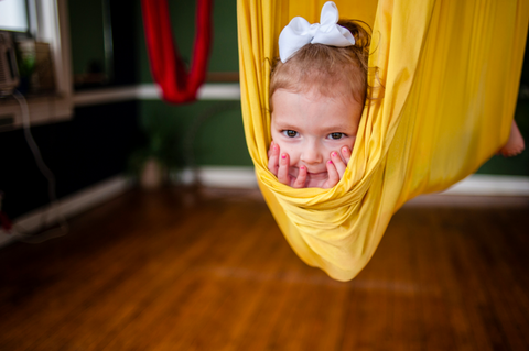 Child in Yellow Yoga Hammock