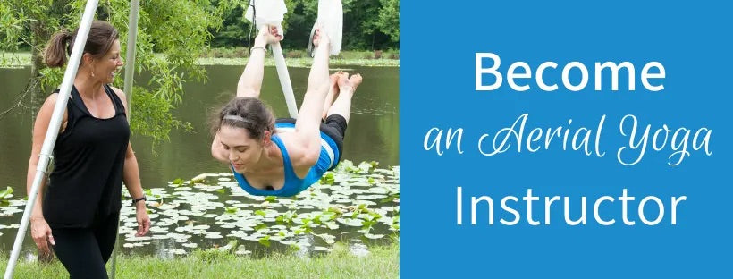 Two girls doing aerial yoga teacher training with the text “Become an aerial yoga instructor”