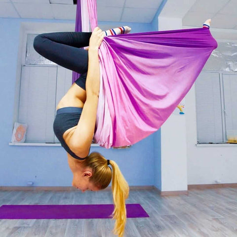 Girl doing an inversion on our Purple Ombre Aerial Hammock