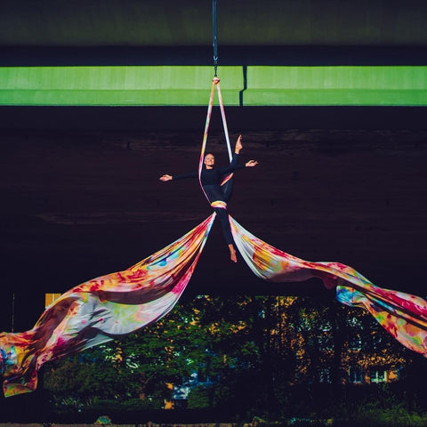 Girl performing aerial yoga in our Watercolor Batik Silks