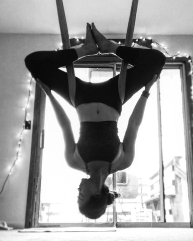 Girl doing an inversion on her Aerial Yoga Hammock