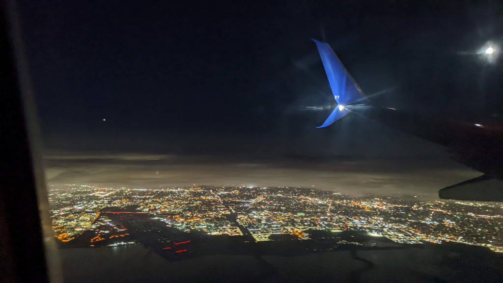 View outside airplane window at night