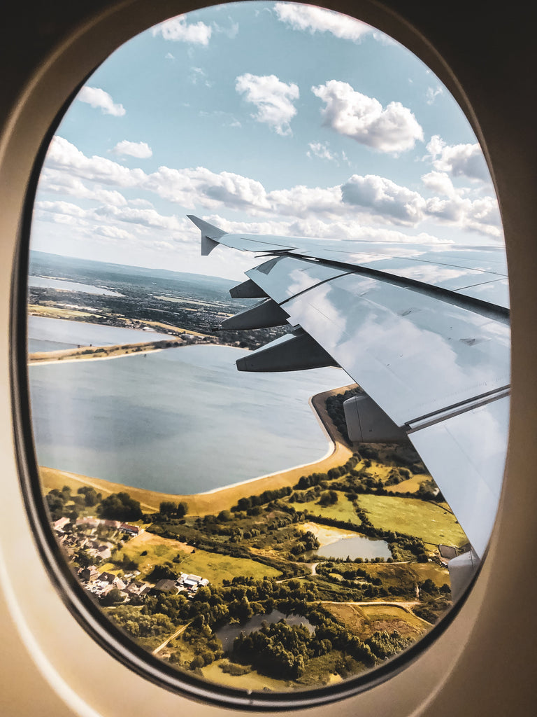 Aisle seat on Airplane window with a view. Photo by Tove Liu: https://www.pexels.com/photo/airplane-window-seat-view-4004016/