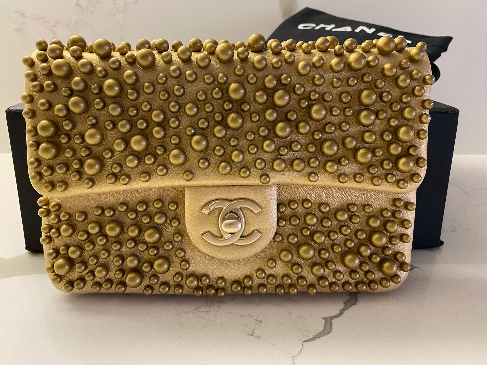 chanel gold pearl bag