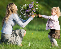 mother and girl with flowers
