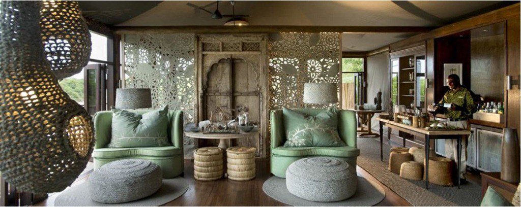 Kaross hand-embroidered cushions featured as decor in a South African game lodge
