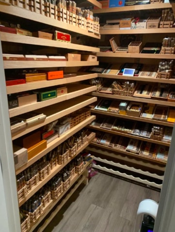 Two stacks of shelves in a large walk-in humidor to show how to build a walk in humidor