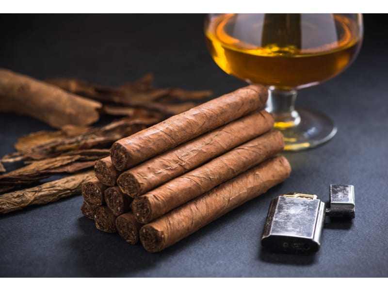 Stack of cigars with cognac