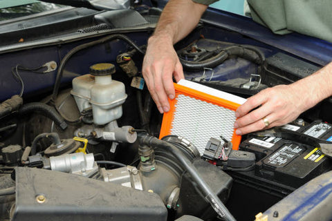 Air Filter being placed inside the car engine
