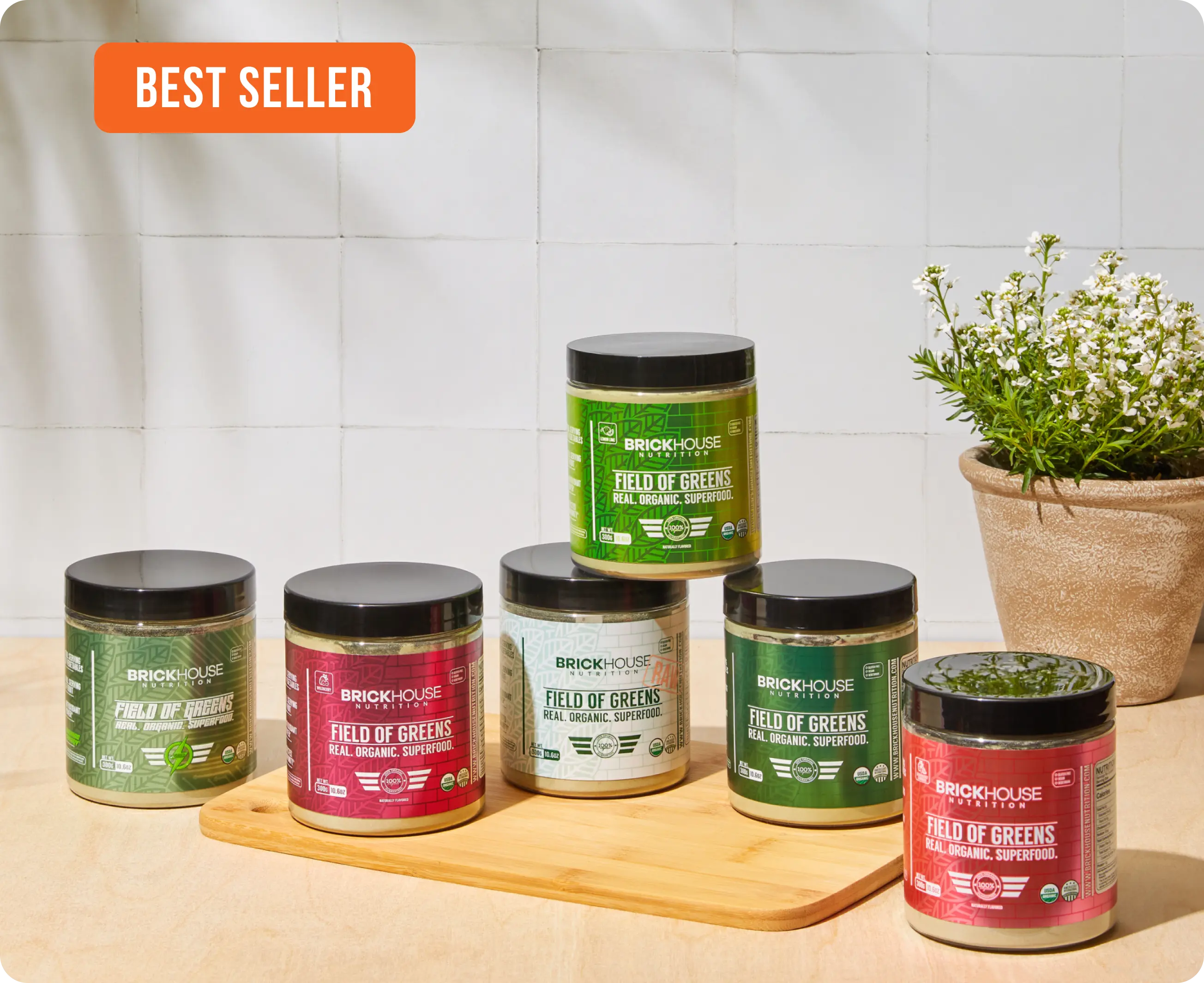 'Multiple jars of BrickHouse Nutrition's Field of Greens superfood powders labeled 'Best Seller.''