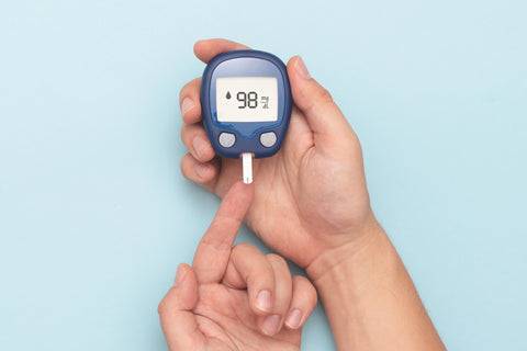 blood glucose meter showing good reading