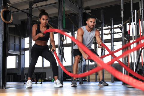 couple with battle ropes