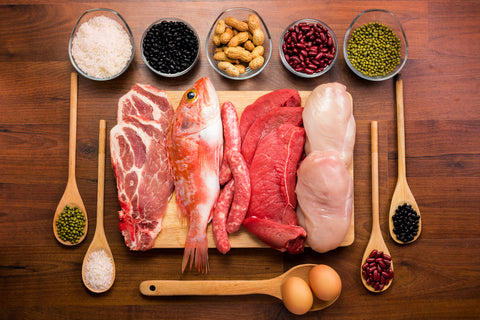 numerous protein food choices lined up on a kitchen countertop