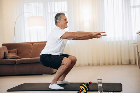 elderly man exercises at home