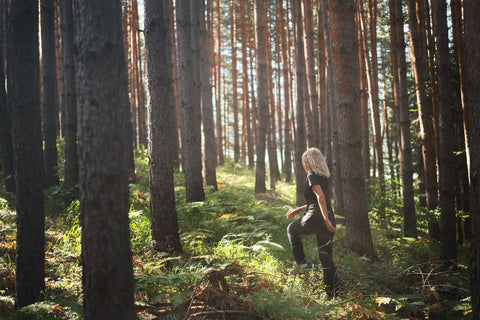 woman forest bathing in nature