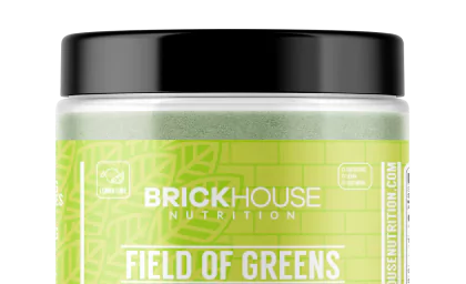Container of Brickhouse Nutrition's Field of Greens supplement with a black lid.