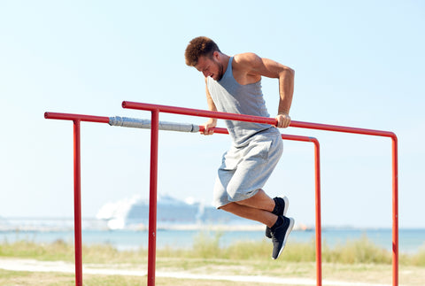 man performing dips on bar