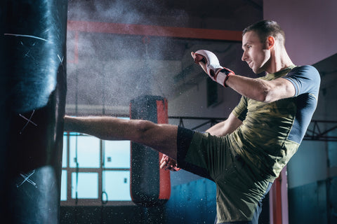 man practicing kickboxing moves