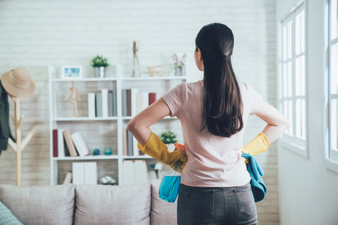 woman cleaning up around the house