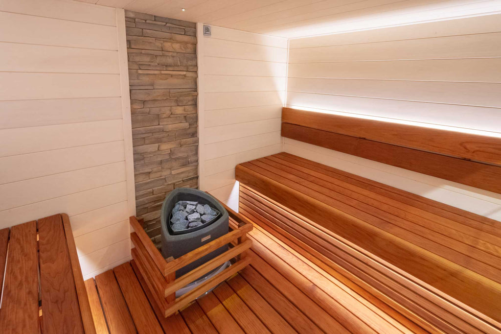 cladding is a raw aspen that is treated with a white supi sauna wax to further increase that light sauna interior which the client was after. The thermo-aspen used for the benches can make a room feel quite dark if used on all surfaces. Using a pale white timber on the walls helps to brighten the space. 
