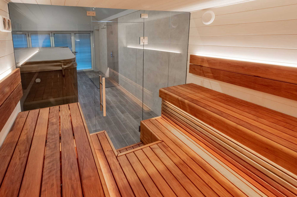 The bench arrangement is one of our favourite layouts for sauna benching, as we (The Sauna Twins) love this communal feel that comes from being able to face other sauna users and have a chat. It is two opposing raised benches with a raised floor in between them.