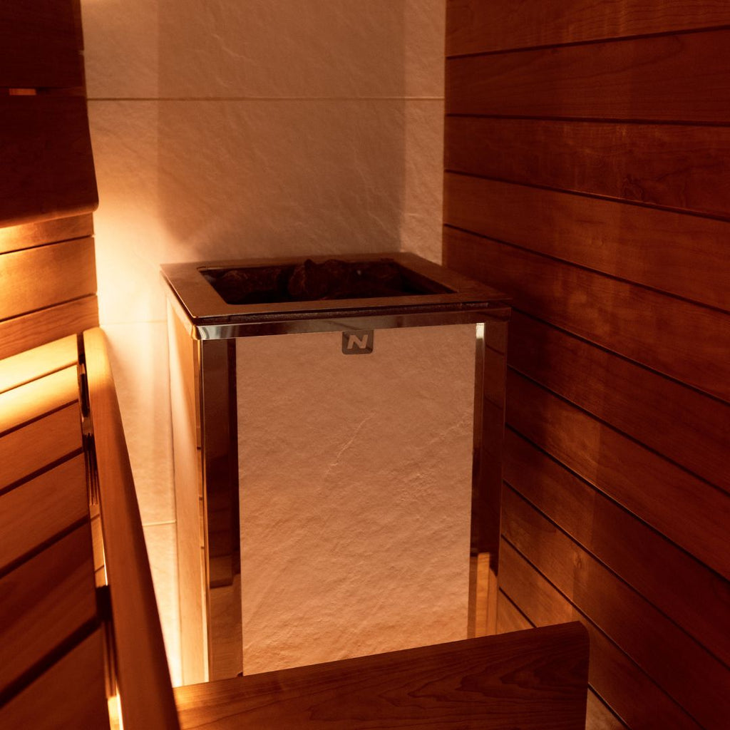 Bespoke home sauna installation with a white feature wall