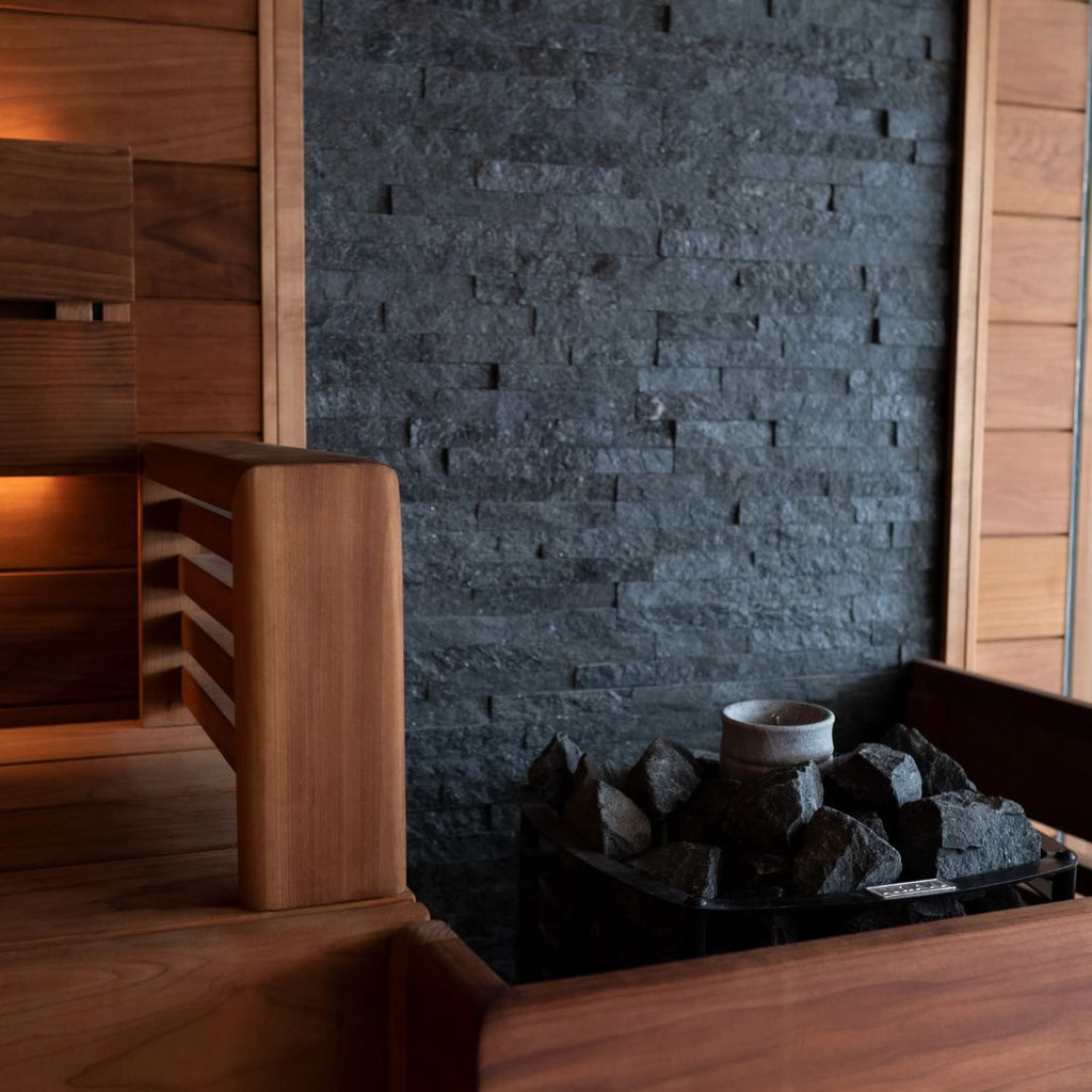 Bespoke commercial sauna installation with a splashback feature wall