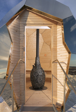 The wood burning sauna heater inside the golden egg sauna