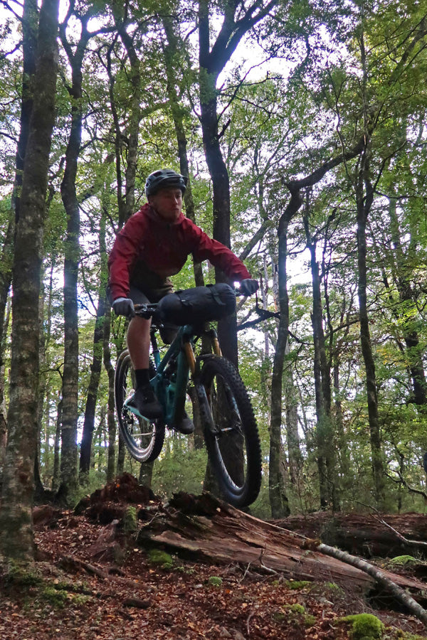 Tom jumping some roots on the descent