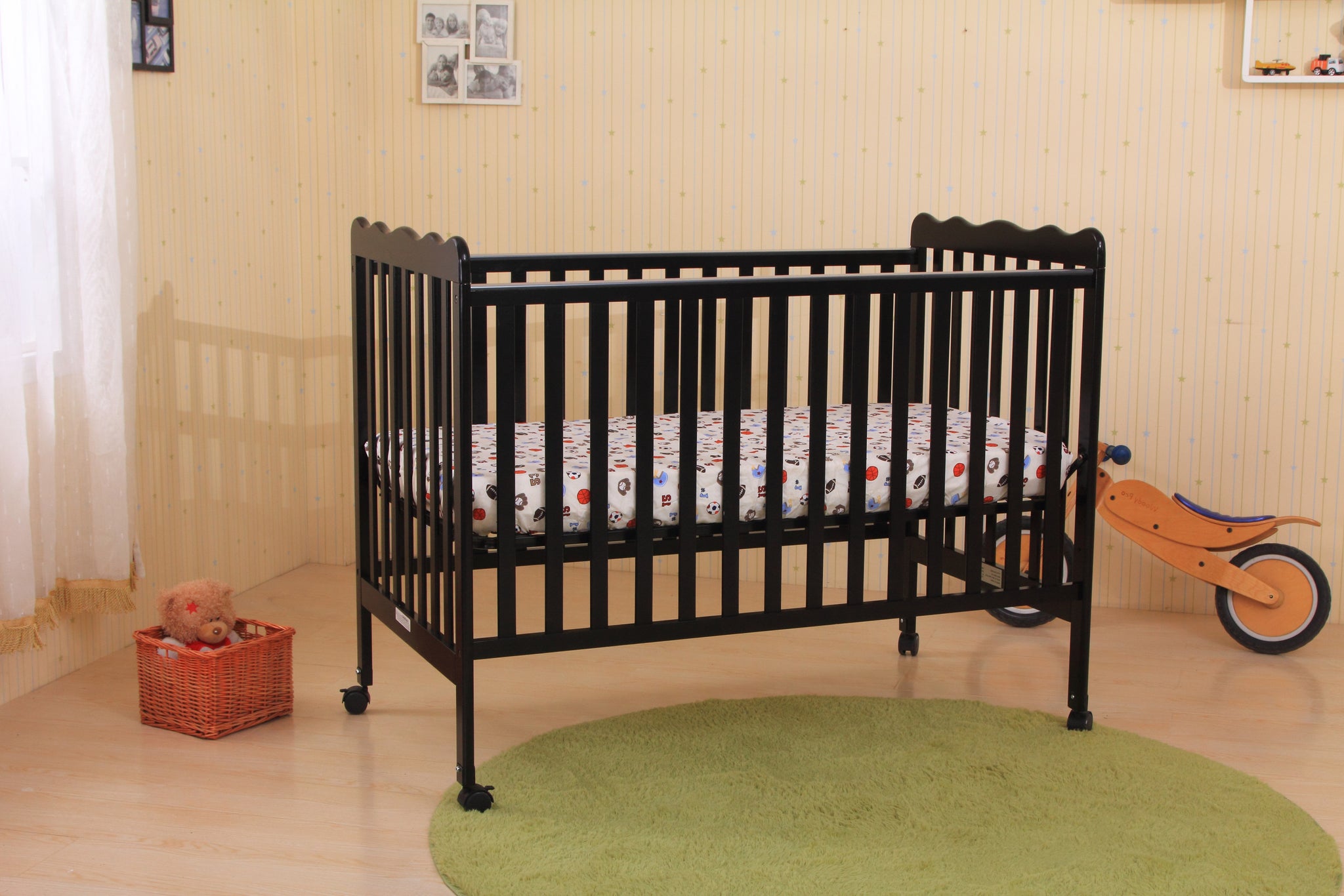 black and natural wood crib