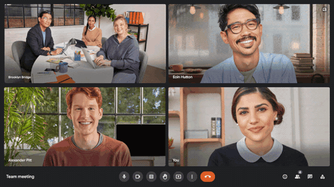 A short video showcasing the new companion mode check-in feature in a Google Meet call. The video starts by displaying a video tile of three individuals in a conference room. Beneath the conference room name "Brooklyn Bridge", the names of each of the three participants appear in a row, indicating that they have checked in to the conference room. The video then zooms out to reveal the rest of the Google Meet call, featuring three additional participants working remotely.