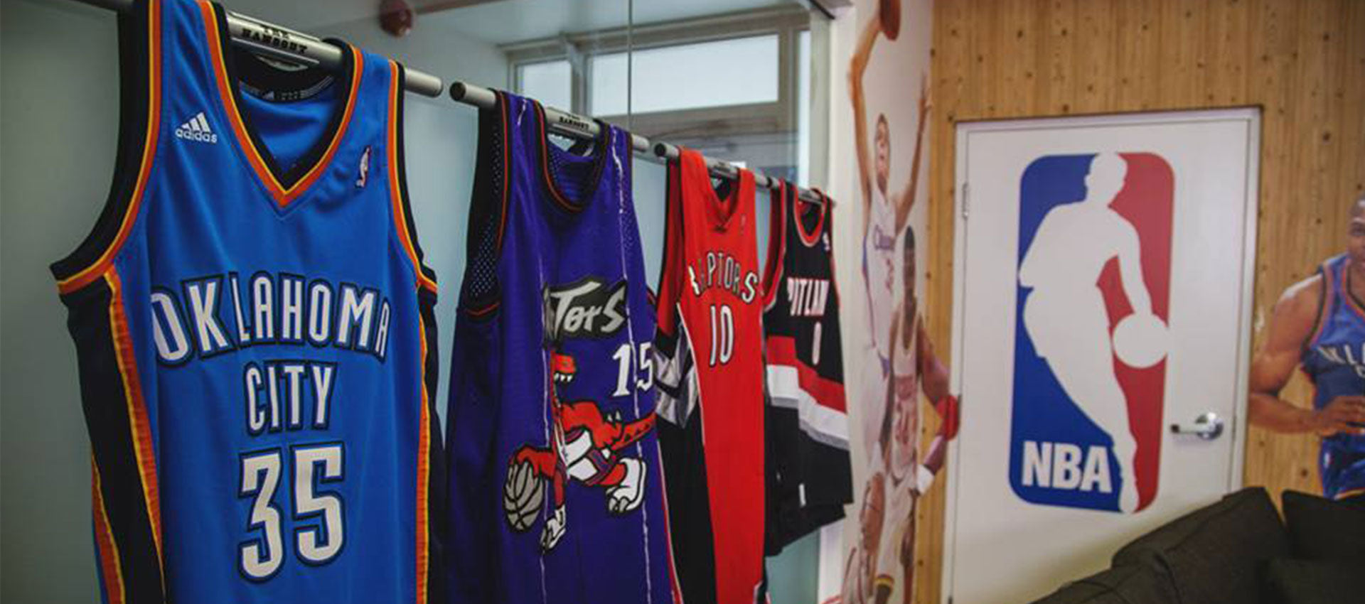 displaying jerseys on a wall