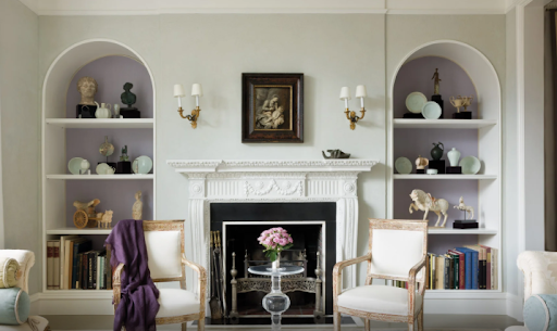 an ornately decorated traditional lounge with purple and pale green accents.