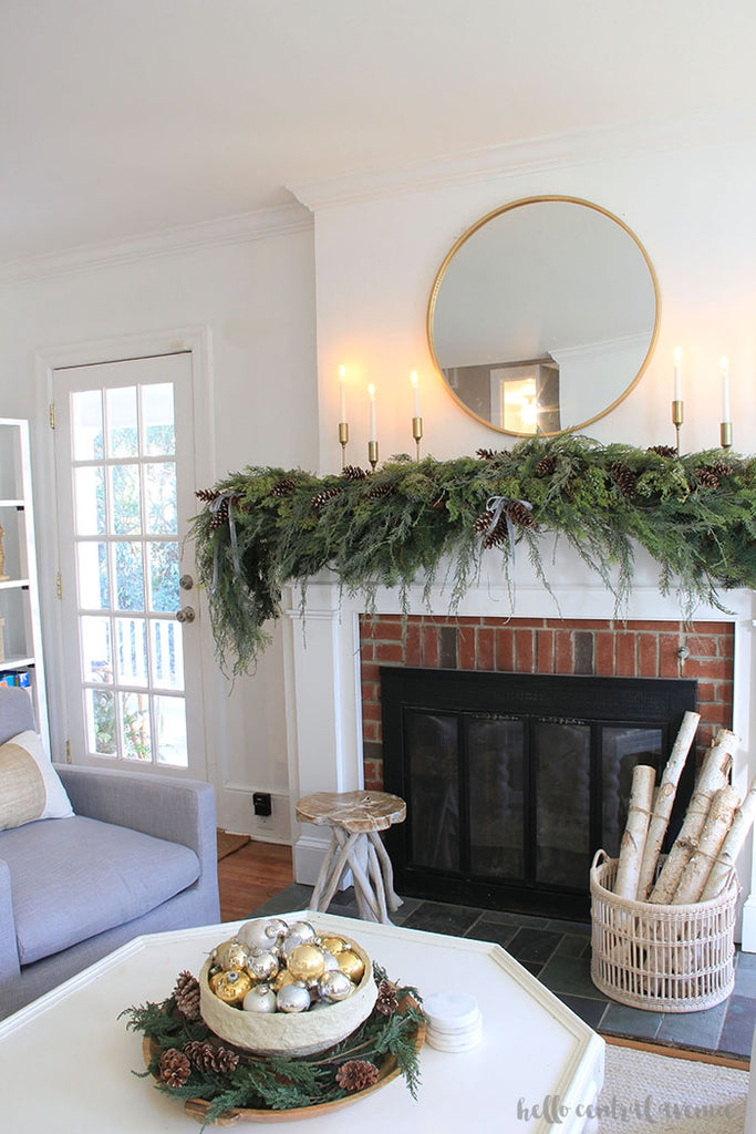 A lounge with fireplace and decorative faux garland