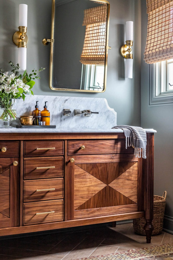 A bathroom decorated in the transitional style, with a wooden vanity unit
