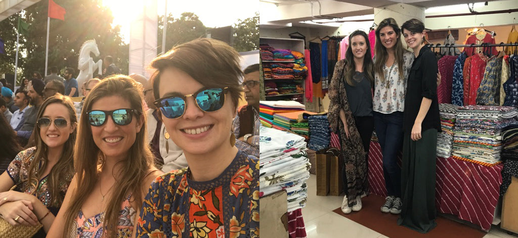 Pink Chicken team members wearing sunglasses and smiling while shopping at an outdoor market in India