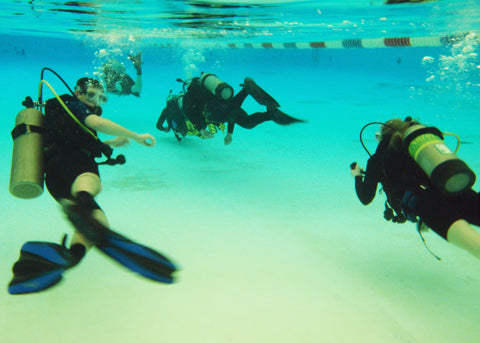Divers in a pool