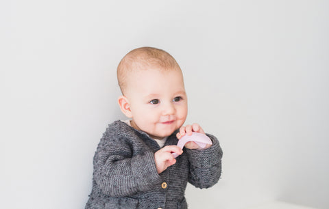 little boy holding a spoon